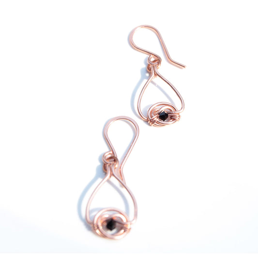Copper double coin knot dangle earrings with black onyx beads hand made in USA Carrie Foscato design