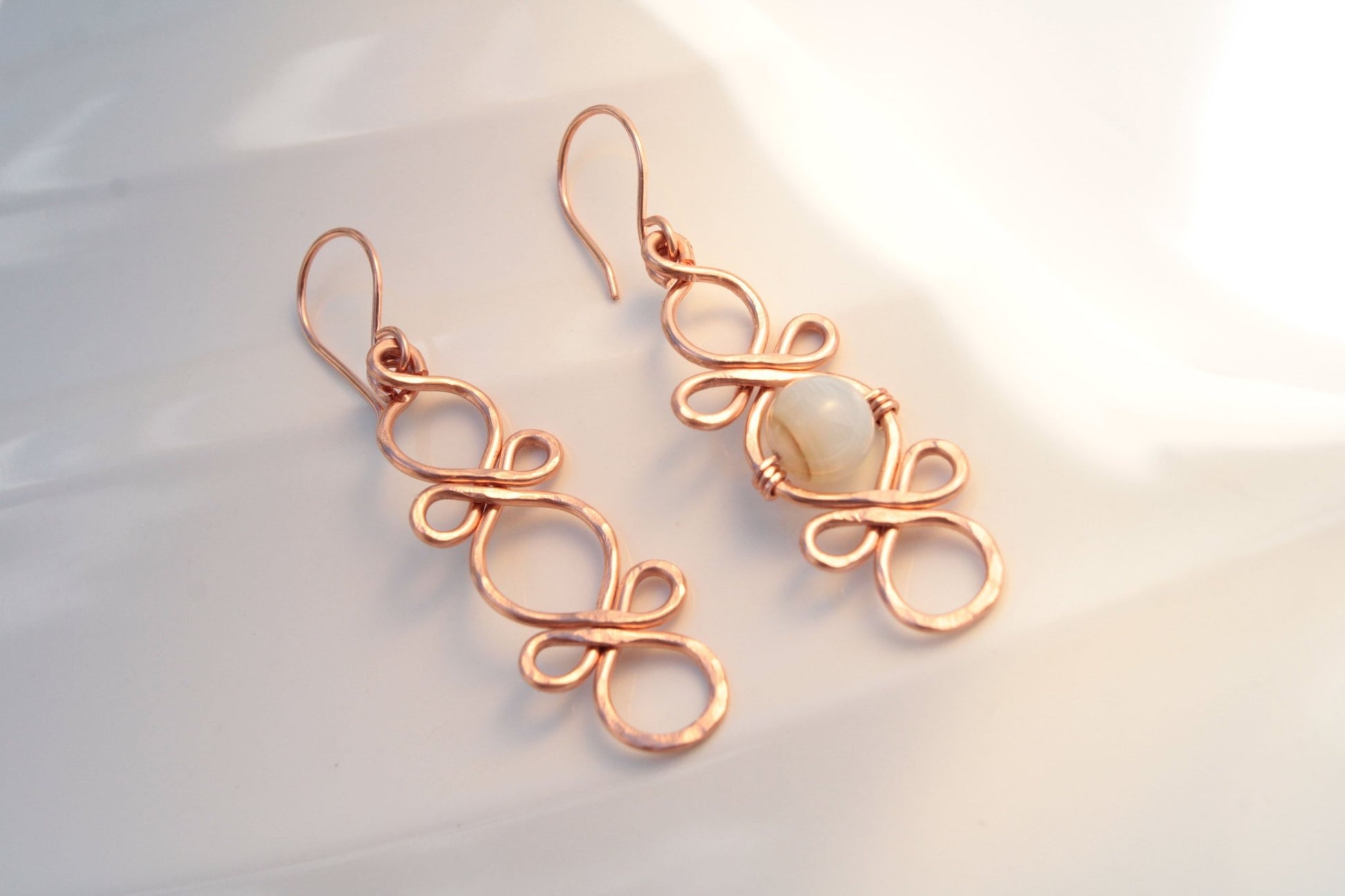 Triple Infinity Looped with custom accent bead handmade french ear wires carrie foscato design USA