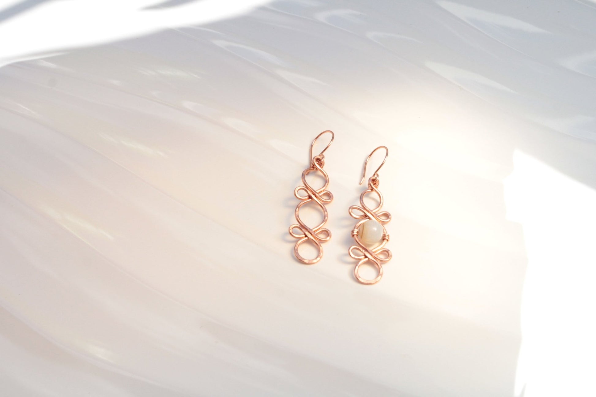 Triple Infinity Looped with custom accent bead handmade french ear wires carrie foscato design USA